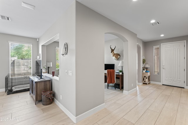 16404 S 18th Dr, Phoenix, AZ 85045 - entrance foyer featuring arched walkways, light wood-style flooring, baseboards, and recessed lighting