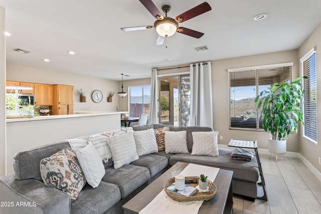 16404 S 18th Dr, Phoenix, AZ 85045 - living room with ceiling fan, light wood-style flooring, recessed lighting, and baseboards