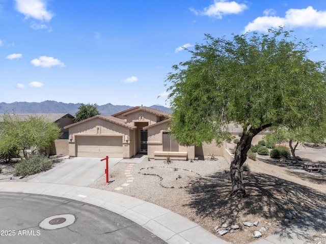 16404 S 18th Dr, Phoenix, AZ 85045 - view of front of property with stucco siding, a garage, driveway, a tiled roof, and a mountain view