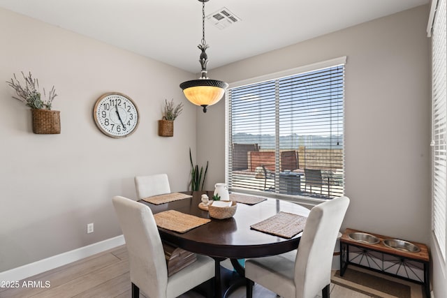 16404 S 18th Dr, Phoenix, AZ 85045 - dining area with baseboards and light wood-style flooring