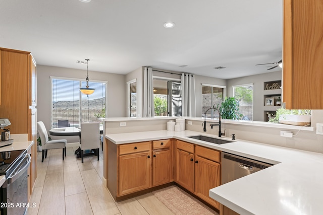 16404 S 18th Dr, Phoenix, AZ 85045 - kitchen featuring a sink, stainless steel appliances, light countertops, hanging light fixtures, and recessed lighting