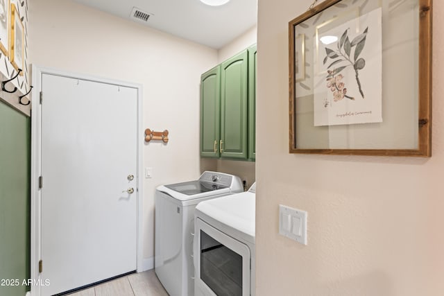 16404 S 18th Dr, Phoenix, AZ 85045 - laundry area with cabinet space, separate washer and dryer, and light wood-style flooring