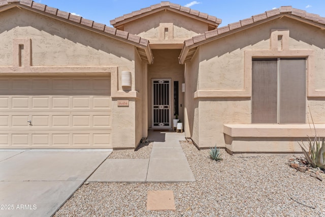 16404 S 18th Dr, Phoenix, AZ 85045 - view of front of property with an attached garage, concrete driveway, and stucco siding