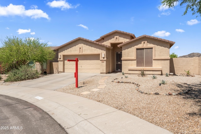 16404 S 18th Dr, Phoenix, AZ 85045 - view of front of home with stucco siding, a garage, and driveway