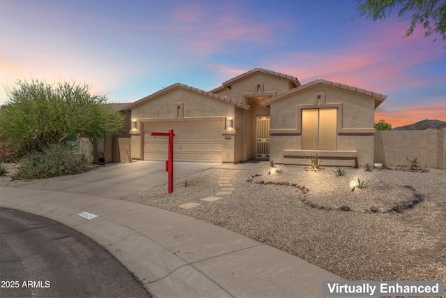16404 S 18th Dr, Phoenix, AZ 85045 - view of front of house featuring an attached garage, driveway, and stucco siding