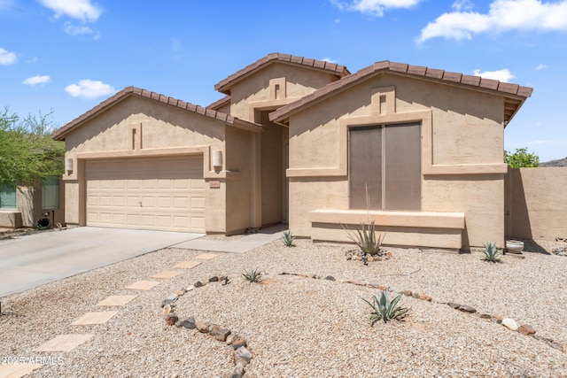 16404 S 18th Dr, Phoenix, AZ 85045 - view of front of property featuring an attached garage, concrete driveway, and stucco siding