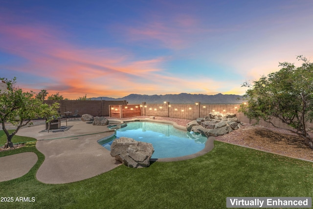 16404 S 18th Dr, Phoenix, AZ 85045 - pool at dusk featuring a patio and a mountain view
