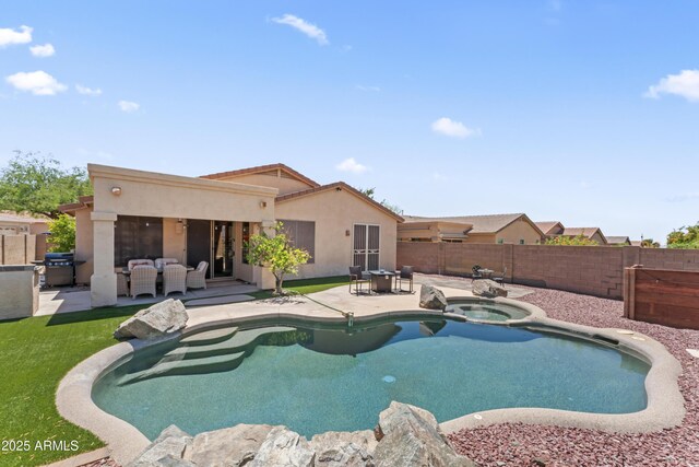 16404 S 18th Dr, Phoenix, AZ 85045 - view of swimming pool featuring a patio, a fenced backyard, an outdoor living space, and a pool with connected hot tub