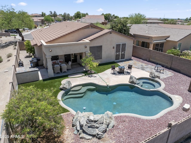 16404 S 18th Dr, Phoenix, AZ 85045 - view of swimming pool featuring a patio, a fenced backyard, a pool with connected hot tub, and an outdoor hangout area