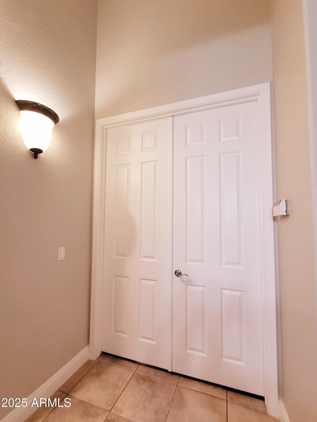 interior space featuring baseboards