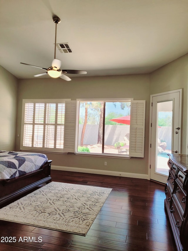 bedroom featuring baseboards, multiple windows, access to outside, and visible vents