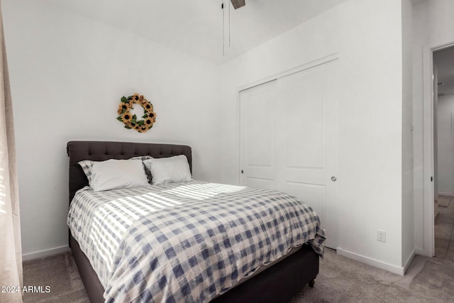 bedroom with carpet flooring, a closet, and ceiling fan