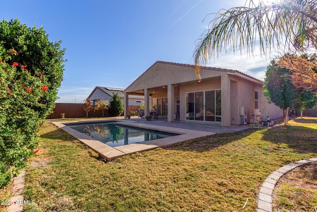 view of pool featuring a yard and a patio area