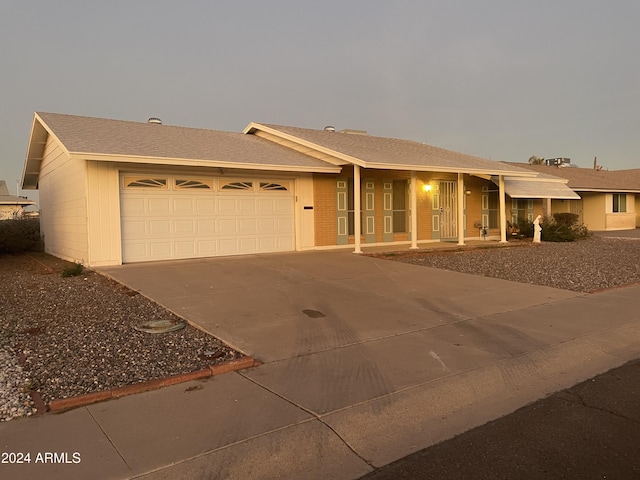 ranch-style home featuring a garage