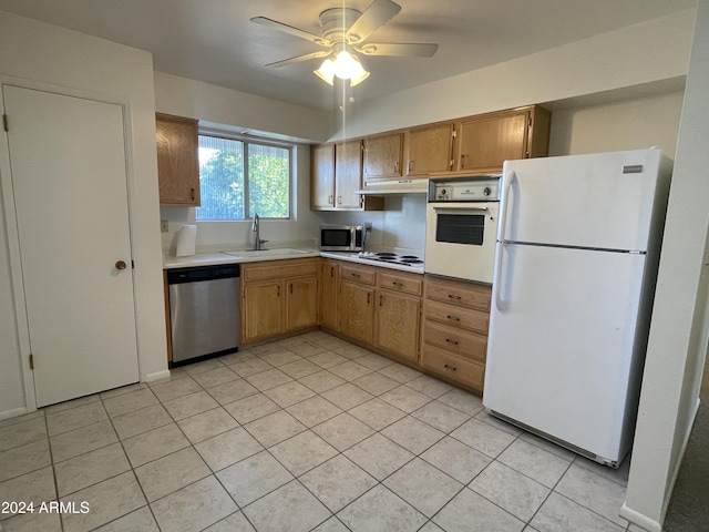 kitchen featuring ceiling fan, sink, light tile patterned floors, and stainless steel appliances