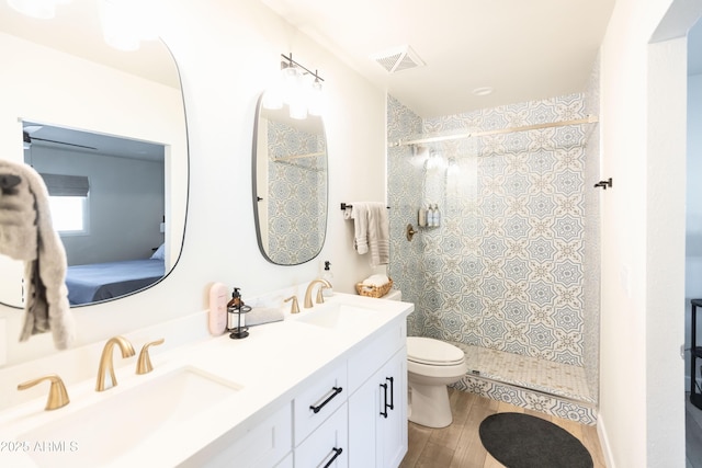 8132 E Valley View Rd, Scottsdale, AZ 85250 - bathroom with visible vents, toilet, a stall shower, and a sink