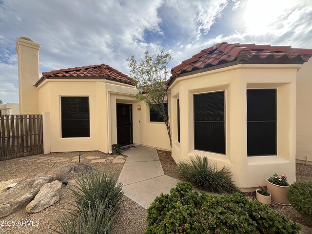 2169 E Bishop Dr, Tempe, AZ 85282 - view of exterior entry featuring stucco siding and a tiled roof