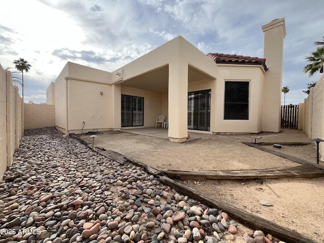 2169 E Bishop Dr, Tempe, AZ 85282 - rear view of property with a patio, a tiled roof, a fenced backyard, and stucco siding