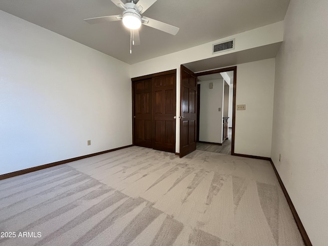 2169 E Bishop Dr, Tempe, AZ 85282 - unfurnished bedroom featuring light colored carpet, baseboards, ceiling fan, and a closet