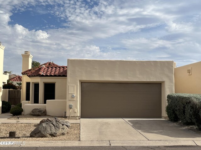 2169 E Bishop Dr, Tempe, AZ 85282 - view of front of property with stucco siding, a garage, concrete driveway, and a tiled roof
