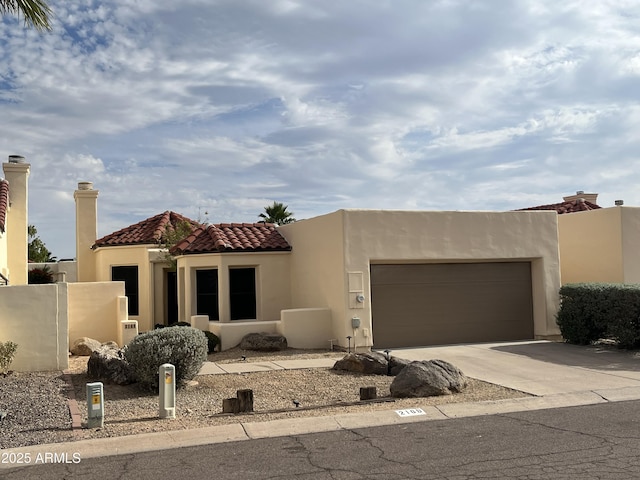 2169 E Bishop Dr, Tempe, AZ 85282 - view of front of house with concrete driveway, stucco siding, a garage, and a tiled roof