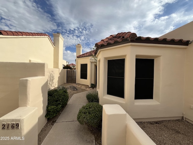 2169 E Bishop Dr, Tempe, AZ 85282 - view of home's exterior with stucco siding and a tile roof