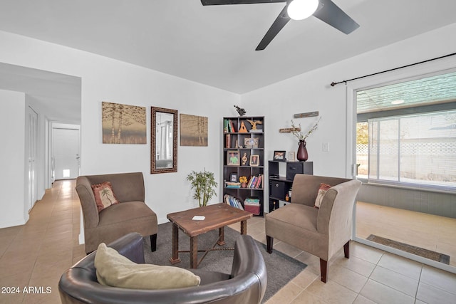 living room featuring ceiling fan and light tile patterned floors