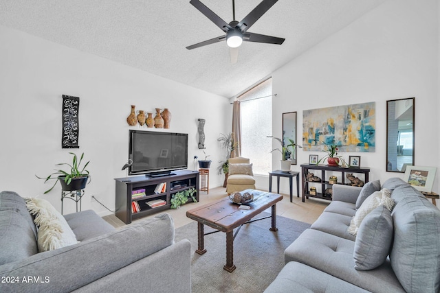 living room featuring a textured ceiling, light tile patterned flooring, high vaulted ceiling, and ceiling fan