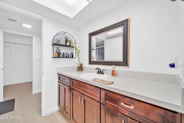 bathroom with vanity and tile patterned floors