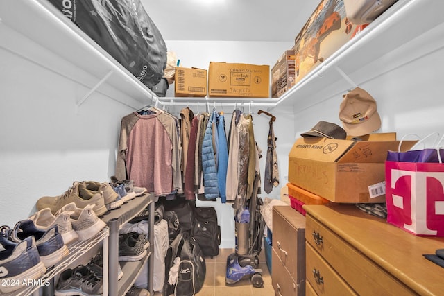 walk in closet featuring tile patterned flooring