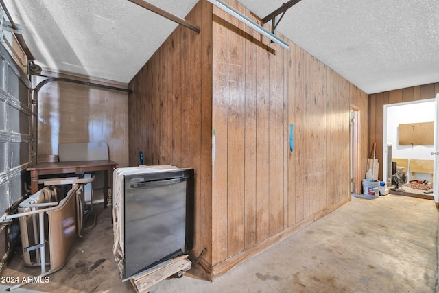 garage featuring wooden walls