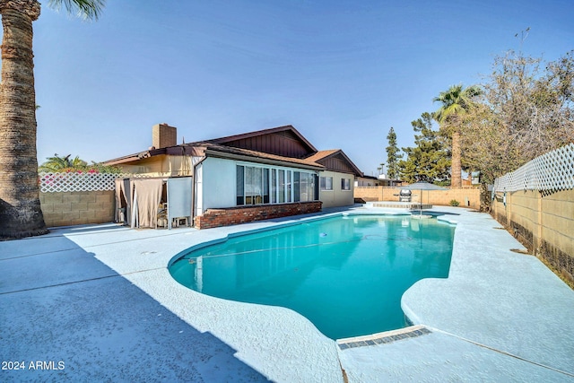 view of pool featuring a patio