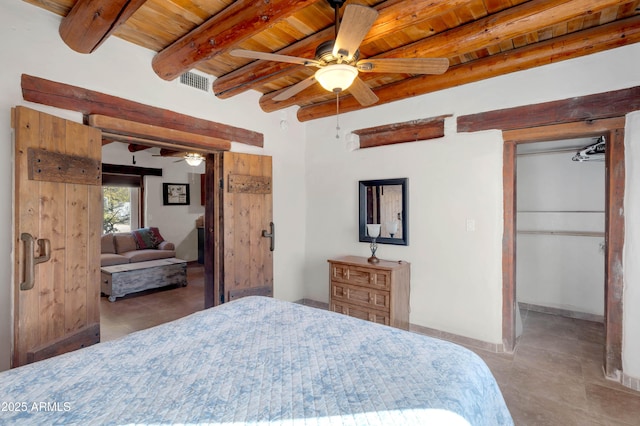 bedroom with beamed ceiling, ceiling fan, and wood ceiling