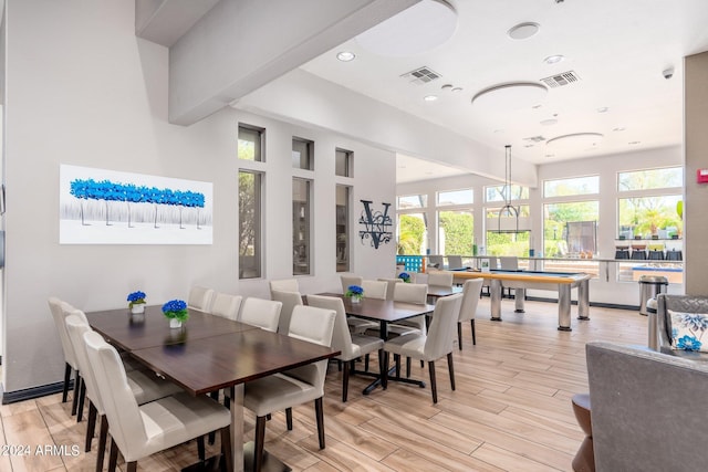 dining area with visible vents, recessed lighting, lofted ceiling with beams, and light wood-style floors