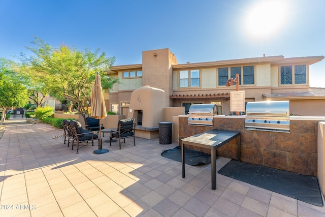 view of patio with area for grilling and grilling area