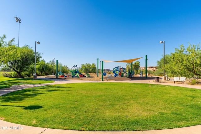 view of community with a lawn and playground community