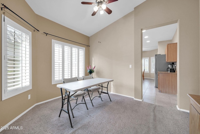 carpeted office featuring vaulted ceiling and ceiling fan