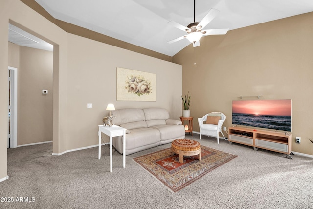 living room featuring ceiling fan, carpet, and vaulted ceiling