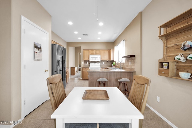 tiled dining space with sink