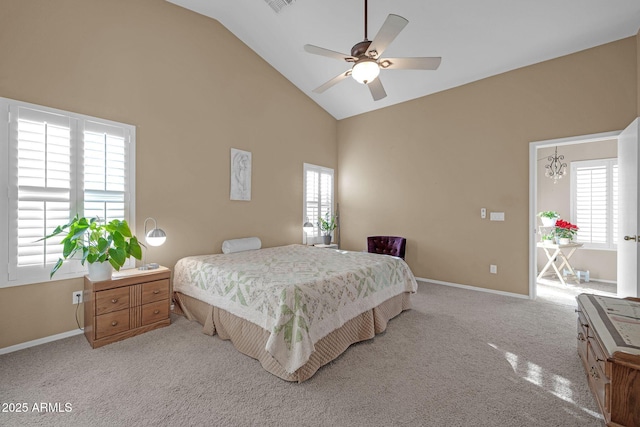 bedroom featuring multiple windows, ceiling fan, and light carpet