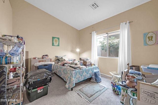 carpeted bedroom featuring lofted ceiling