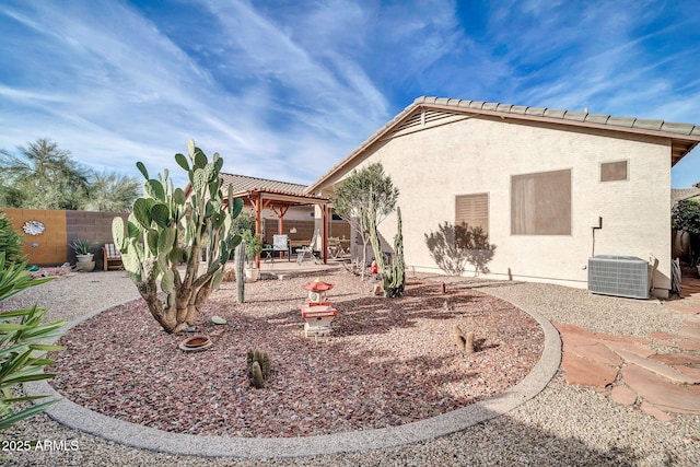 back of house with cooling unit and a patio