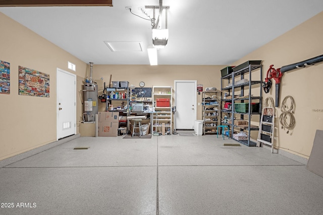 garage featuring a garage door opener and water heater