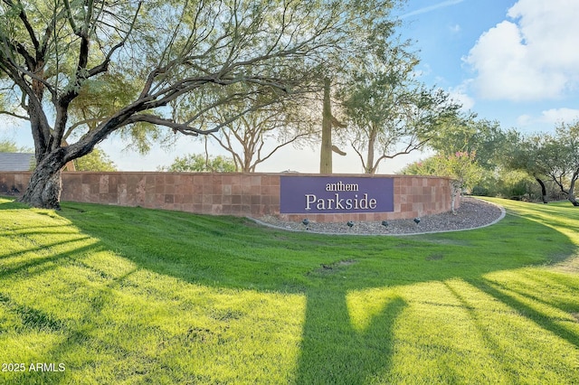 community / neighborhood sign with a lawn