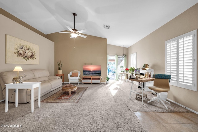 living room with ceiling fan, carpet, and lofted ceiling