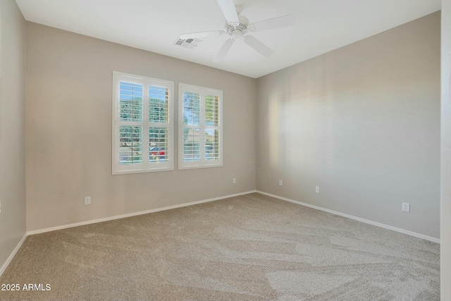 spare room with ceiling fan and carpet flooring