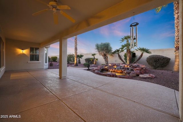 patio terrace at dusk with ceiling fan