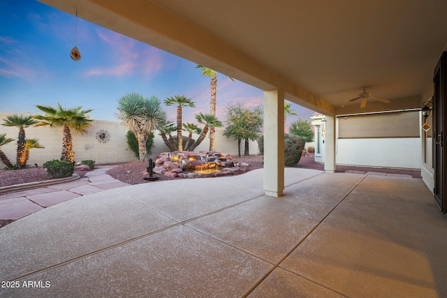 patio terrace at dusk with ceiling fan