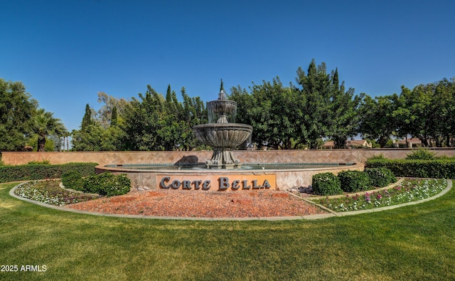 community / neighborhood sign with a lawn