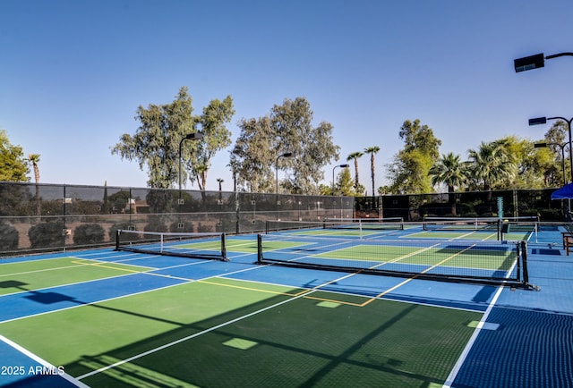 view of sport court with basketball hoop